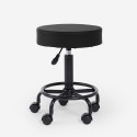 Taburete de esteticista ergonómico regulable tapizado giratorio Senzu. Modelo