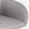 Silla moderna acolchada de tela con reposabrazos Rikku Stock