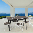 conjunto de mesa rectangular 120 x 60 con 4 sillas acero madera diseño industrial otis Stock